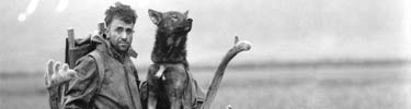 Glacier Priest Father Bernard Hubbard and dog at Aniakchak