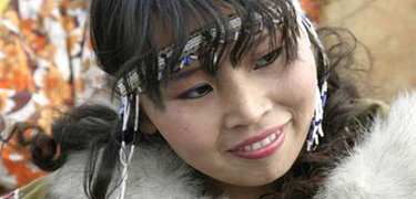 Young woman from Chukotka Peninsula, Russia, in traditional dress.