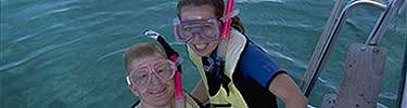 Snorkelers prepare to explore the coral reef.