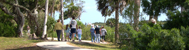 Visitors walk along the trail at Seminole Rest..