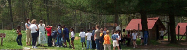 school kids getting in line for a drink after a visit to the barnyard