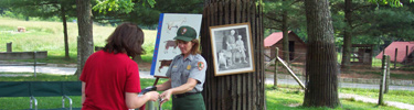 Park Ranger demonstrating how to make goat's milk cheese