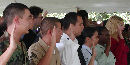 New citizens are sworn at the annual naturalization ceremony. New citizens are sworn at the annual naturalization ceremony.