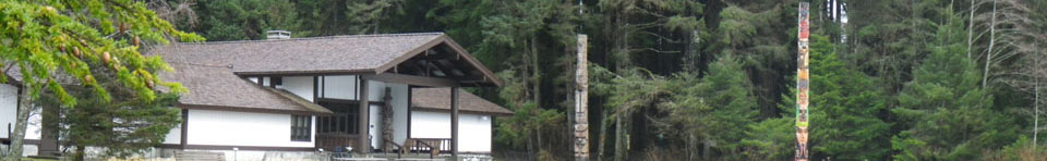 Image of visitor center and totem poles