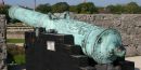 A Spanish bronze cannon shown the characteristic green patina caused by copper rusting A Spanish bronze cannon shown the characteristic green patina caused by copper rusting