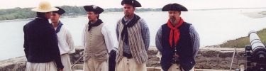 Standing on the gundeck with the Matanzas River for a backdrop, British soldiers recieve instructions from their sergeant.