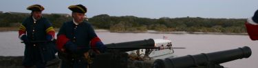 Spanish soldiers prepare to fire one of their cannon.