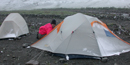 A July snow dusting tents in the Itkillik valley. A July snow dusting tents in the Itkillik valley.