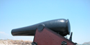 15-inch Rodman cannon has a black barrel and maroon colored carriage. It is located on Fort Massachusetts at Gulf Islands N S. 15-inch Rodman cannon has a black barrel and maroon colored carriage. It is located on Fort Massachusetts at Gulf Islands N S.