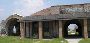 This view is of the tan brick of Fort Pickens with the sally port opening to the right and the remains of the fort on the left.