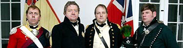 Four living history volunteers portray British officers from the 1815 Battle of New Orleans at Chalmette Battlefield.