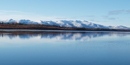 Image of round, snow-capped mountains are reflected perfectly in the calm blue waters of the Kobuk River. Image of round, snow-capped mountains are reflected perfectly in the calm blue waters of the Kobuk River.