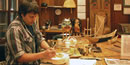 Carver Tommy Joseph works in a Cultural Center studio