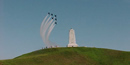 Six Blue Angles jets flying over the monument on top of Kill Devil Hill. Six Blue Angles jets flying over the monument on top of Kill Devil Hill.