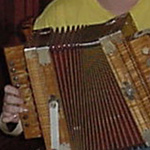 Image of hands playing an accordion