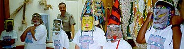 Summer camp kids show off their country Cajun Mardi Gras hats and masks at the Prairie Acadian Cultural Center.