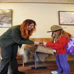 Ranger awards a badge to a new Junior Ranger