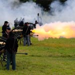 Flames shooting from a Civil War cannon