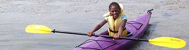 Young girl in a purple kayak at the Timucuan Preserve