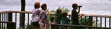 Family enjoying the view from an overlook at Fort Caroline.