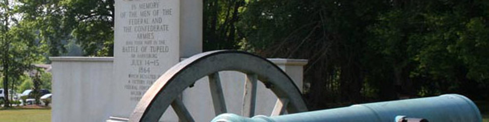 monumnent to the batle of tupelo, with a canon in the foreground 