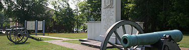 The Tupelo Battlefield Monument is flanked by two artillery pieces.
