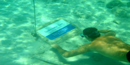 visitor gets a little closer to one of the underwater trail signs in Trunk Bay. visitor gets a little closer to one of the underwater trail signs in Trunk Bay.