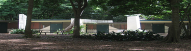 Cottages at Cinnamon Bay Campground which are screened on two sides and concrete on two sides