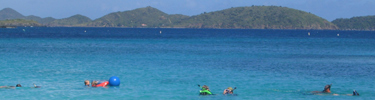 Photo of snorkelers at Trunk Bay.