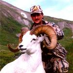 A hunter with a dall sheep ram