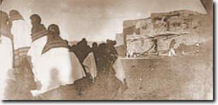 Army guards and Hopi prisoners with crowd waiting and watching.