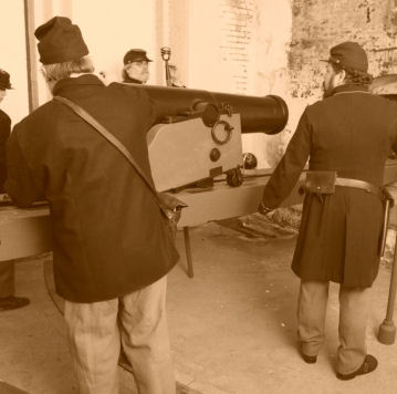 Friends of Civil War Alcatraz and the Alcatraz howitzer in the sally port.