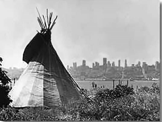 Tipi on grass overlooks bay and SF cityscape