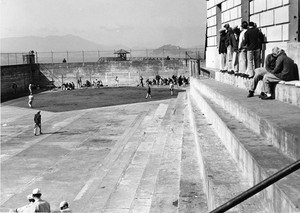 Inmates playing softball in the Alcatraz recreation yard.