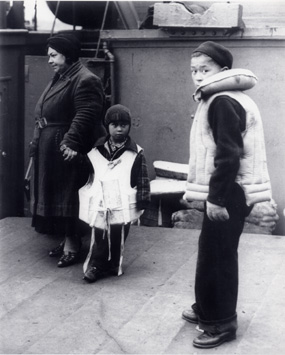 A family from St. Paul waits on the dock for the Delarof to take them away.
