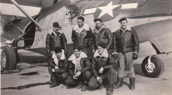 Crewmembers in front of their plane