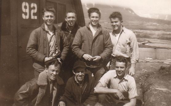 Crewmen in front of a Quonset hut on Attu 