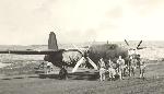 John Pletcher and his crew, October 28, 1942 at Adak, Alaska on the ramp parking area. 