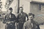 Paul Polink in 1940s, waiting for bus ride to Anchorage (Polink in middle)