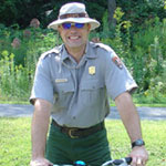 Education Specialist Gregory Zaborowski patrolling on bike