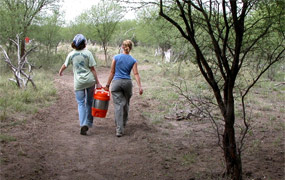 SCAs Amber Beamer and Shannon Garard deliver coolers of water to volunteers. SCAs Amber Beamer and Shannon Garard deliver coolers of water to volunteers.
