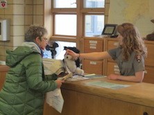 A Ranger assisting a woman at visitor information desk.