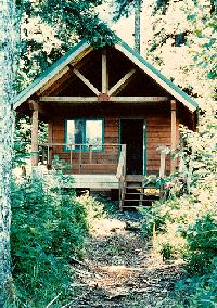 An exterior picture of a cabin at Kenai Fjords National Park during the summer An exterior picture of a cabin at Kenai Fjords National Park during the summer