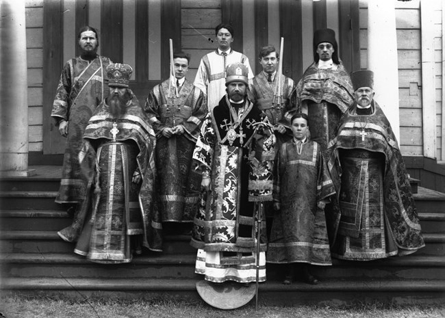 Black and white photo of 9 males ranging in age in orthodox garb.