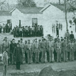 Prisoners of War lined up for roll call in a Federal military prison