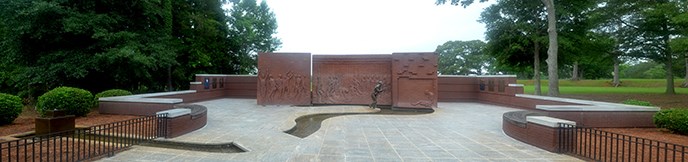 Panoramic photograph of brick and metal sculptural feature