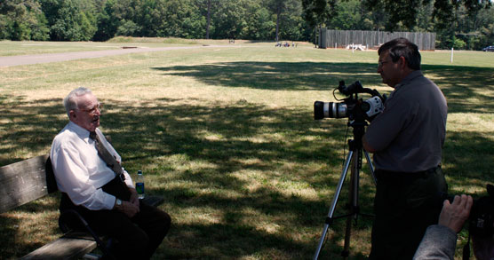 Park ranger interviewing old man at the site of the Andersonville prison