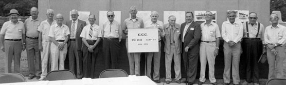 Men standing in front of presentation board.