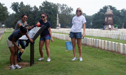 Volunteers cleaning monuments and exhibits 
