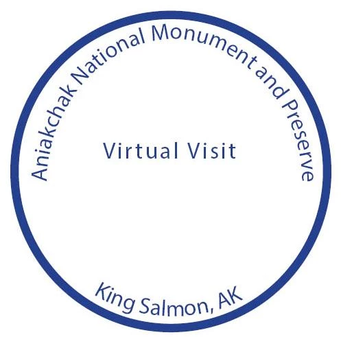ANIA King Salmon Passport Stamp blue text in a blue circle saying, "Aniakchak National Monument & Preserve, Virtual Visit, King Salmon, AK"